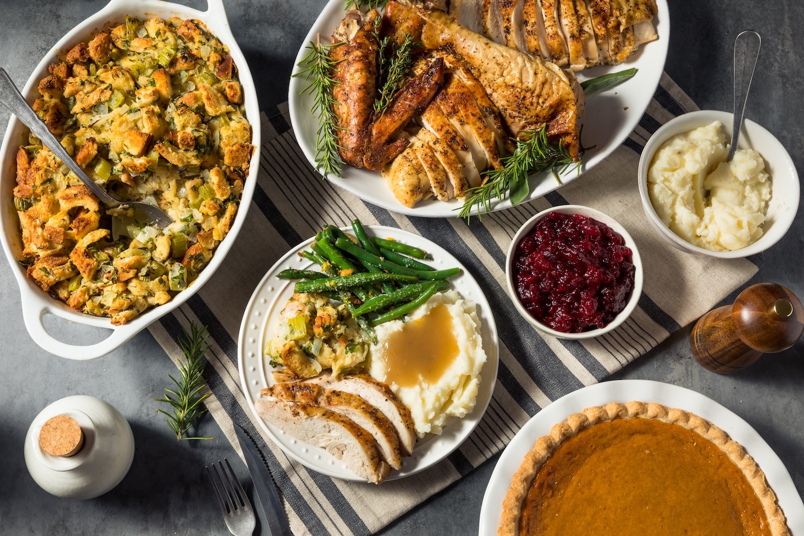 A traditional spread of turkey, cranberry sauce, pie, and stuffing at a Santa Fe Thanksgiving dinner.