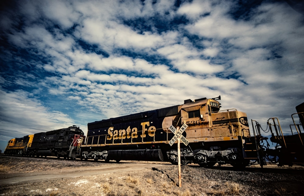 The Best Santa Fe Train Rides 4 Take a ride on a Santa Fe train. Close up view of a train with the words "Santa Fe" on it.